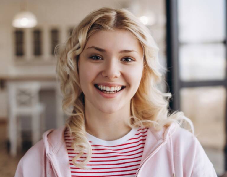 Patient smiling while exploring Invisalign after gum disease treatment